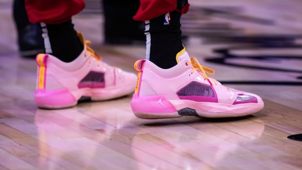 View of Bam Adebayo's pink and purple Air Jordan shoes.